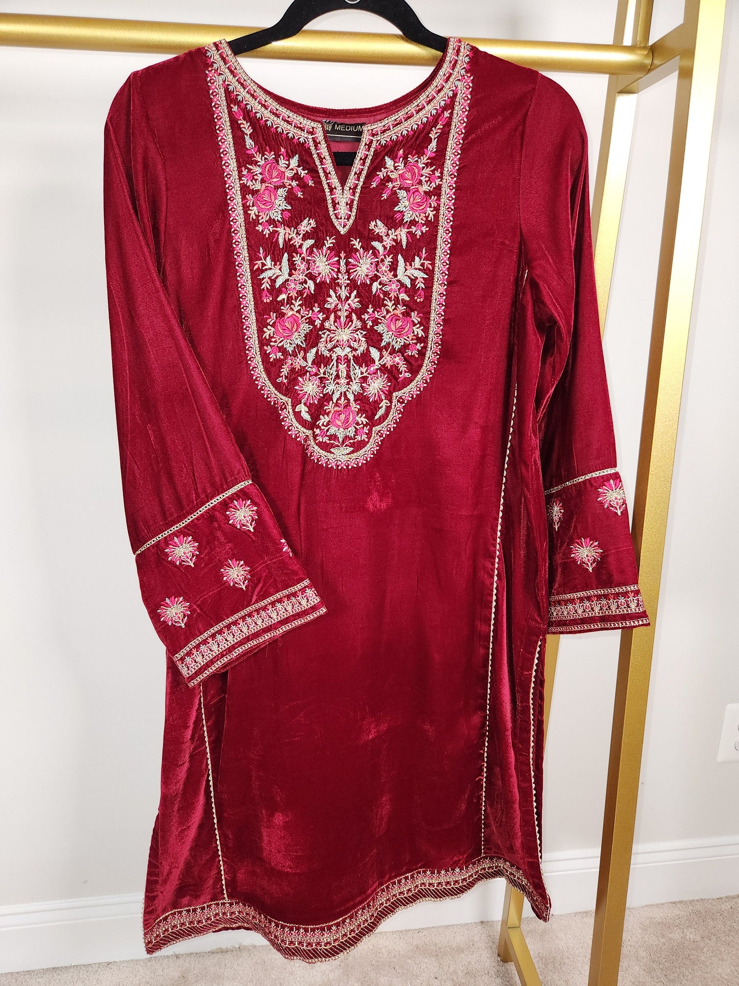 Maroon velvet kurti only with embroidery.