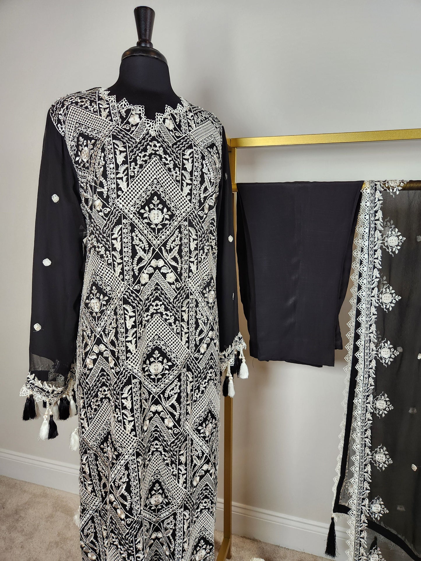 Black and white ! Black base with all over white resham chikankari on shirt and duppata.  Plain trouser included.