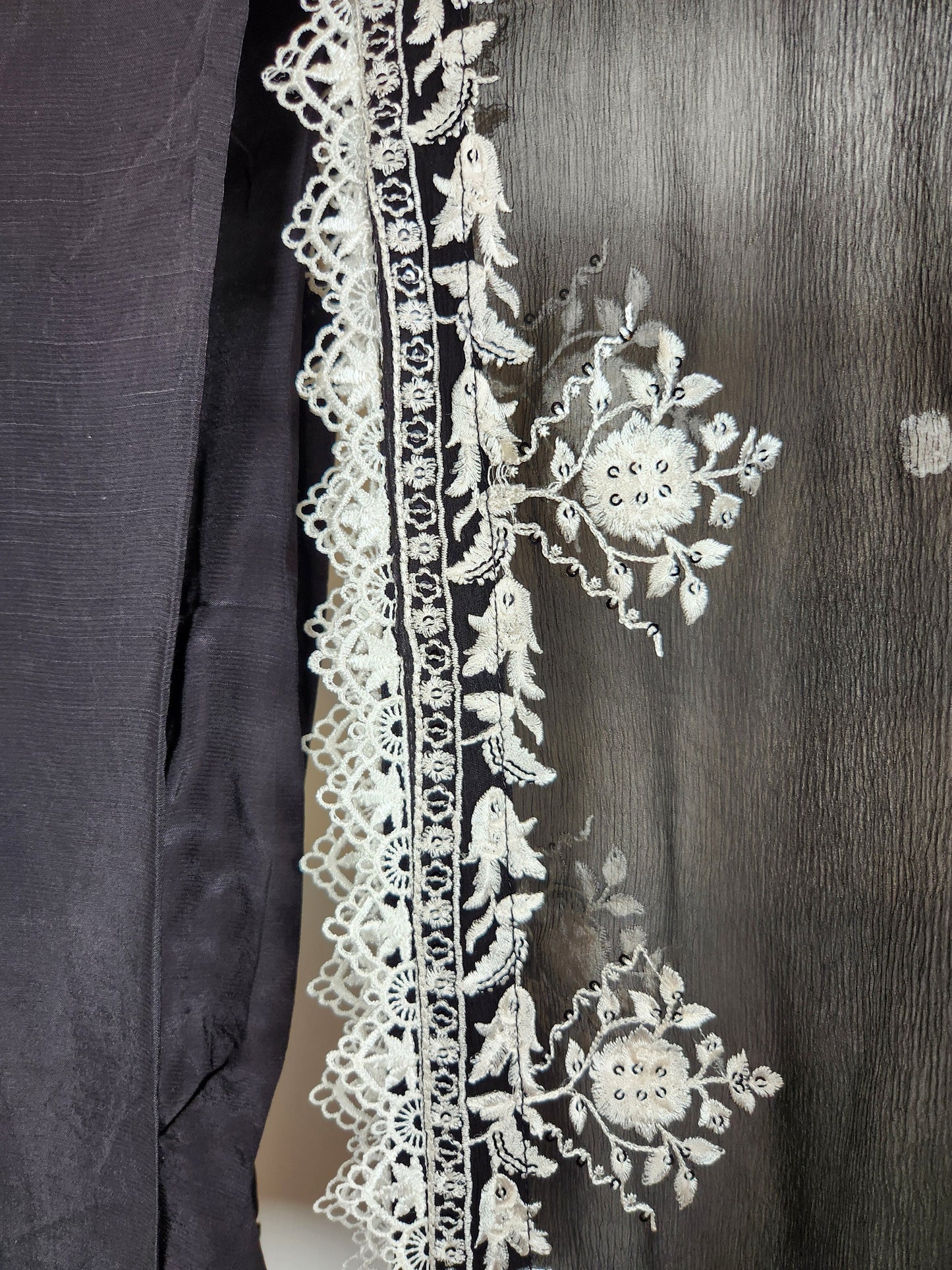 Black and white ! Black base with all over white resham chikankari on shirt and duppata.  Plain trouser included.