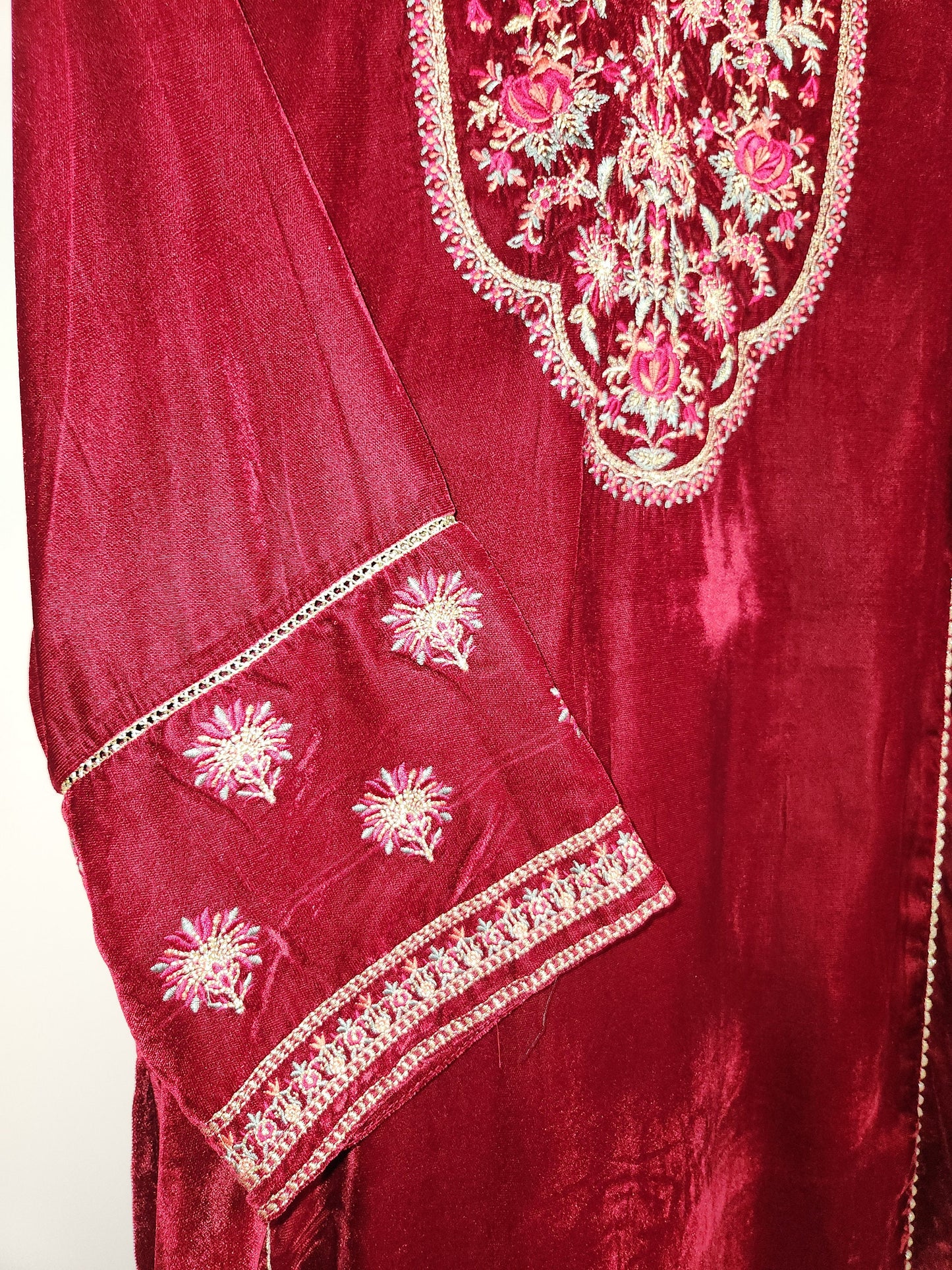 Maroon velvet kurti only with embroidery.